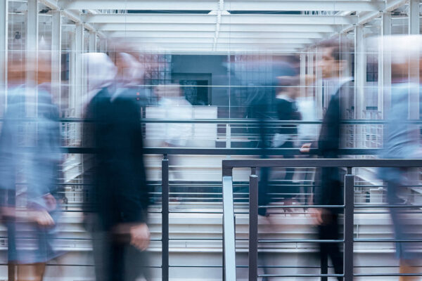 business-people-talking-in-corridor-PSVCLEM(1)